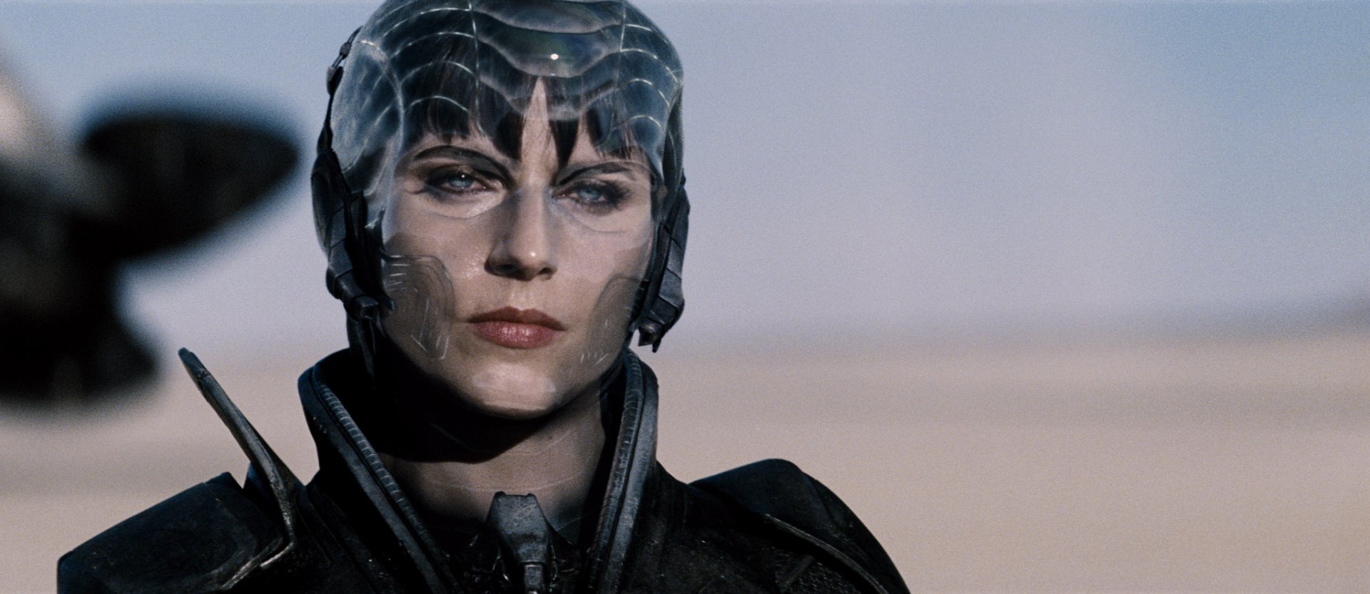 HD PC desktop wallpaper featuring a close-up of Faora, a character from the movie Man of Steel, with her distinctive Kryptonian armor and intense expression.