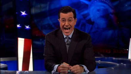 HD wallpaper featuring Stephen Colbert on the set of The Colbert Report, with American flag motifs in the background.