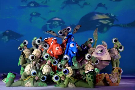 HD desktop wallpaper of Finding Nemo characters with turtles and fish in the ocean background.