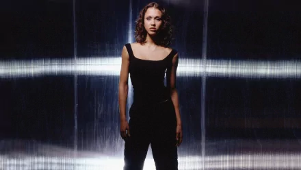 HD desktop wallpaper featuring a female character from the TV show Dark Angel, standing confidently against a dark, futuristic backdrop.