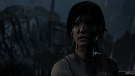 HD PC desktop wallpaper featuring Lara Croft from Tomb Raider, rain-soaked and wary in a dark, shadowy jungle — cinematic video game background.