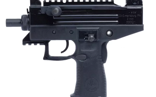 Man-made black Uzi submachine gun close-up (grip, trigger, receiver) on white background — 2K Quad HD PC desktop wallpaper/background.