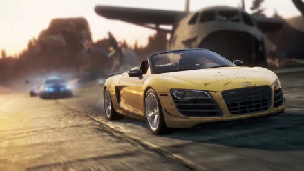 HD PC desktop wallpaper featuring a yellow sports car in a high-speed chase from the video game Need for Speed: Most Wanted (2012).