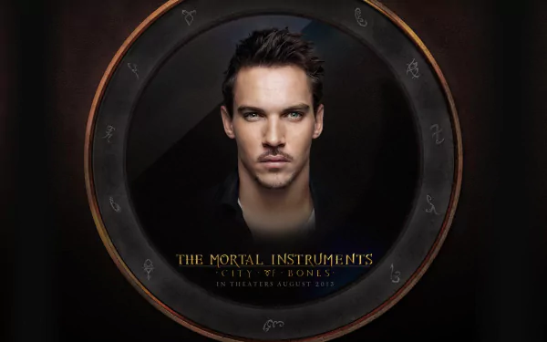Close-up portrait of a serious young man framed by a rune-etched circular frame; text reads The Mortal Instruments: City of Bones — HD PC desktop wallpaper and background.