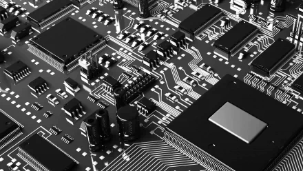 Close-up of a computer circuit board showcasing intricate details of technology. This high-definition wallpaper features various components and connections in a sleek, monochrome design.