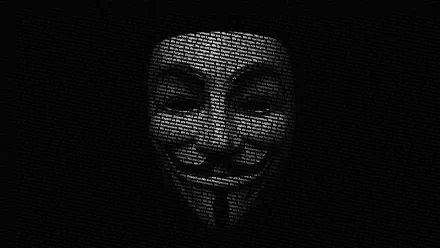 HD wallpaper featuring an anonymous hacker mask, made from coded text, set against a dark background, representing technology and anonymity.