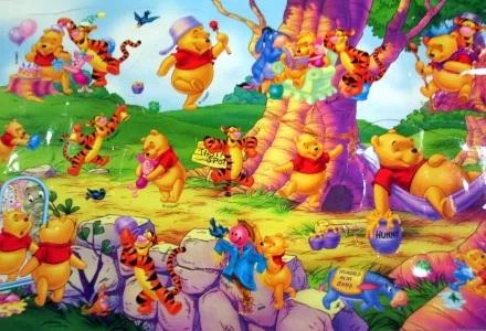 HD desktop wallpaper featuring colorful scenes with multiple Winnie the Pooh characters in various cheerful activities.