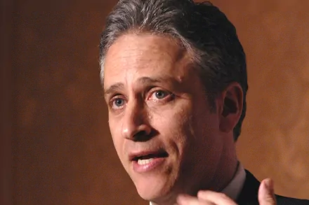 HD desktop wallpaper featuring a person from The Daily Show with Jon Stewart speaking, suitable as a background.