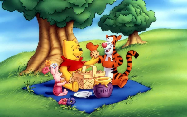 HD wallpaper of Winnie the Pooh, Piglet, and Tigger enjoying a picnic under a tree.