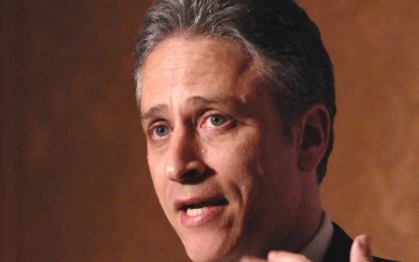 HD desktop wallpaper featuring a person from The Daily Show with Jon Stewart speaking, suitable as a background.