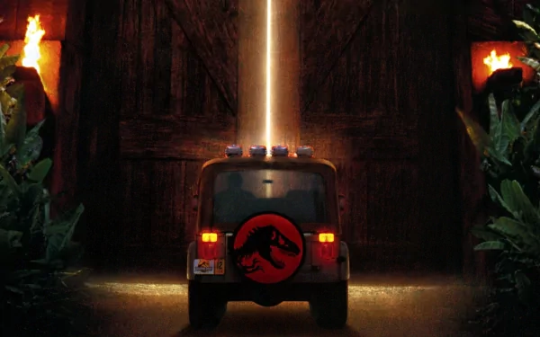 HD Jurassic Park-themed desktop wallpaper featuring a park vehicle spotlighted at the entrance gate with torches on either side.