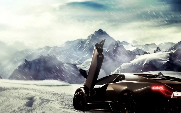 HD PC desktop wallpaper featuring a Lamborghini Reventon with its door open, set against a dramatic snowy mountain landscape.