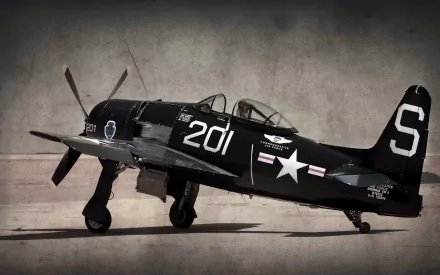 HD desktop wallpaper featuring a military Grumman F8F Bearcat fighter aircraft painted black with white markings, displayed against a neutral background.