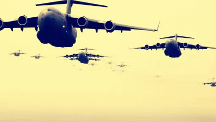 Formation of Boeing C-17 Globemaster III military airplanes flying in the sky, captured in an HD PC desktop wallpaper and background style.