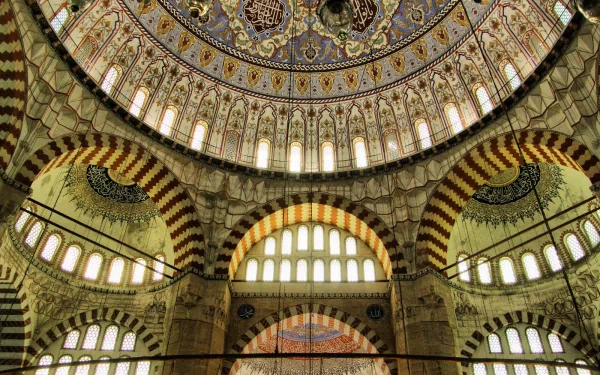 Elegant view of the Selimiye Mosque's stunning ceiling and arches, showcasing intricate patterns and details, captured in high-definition for a captivating desktop wallpaper.