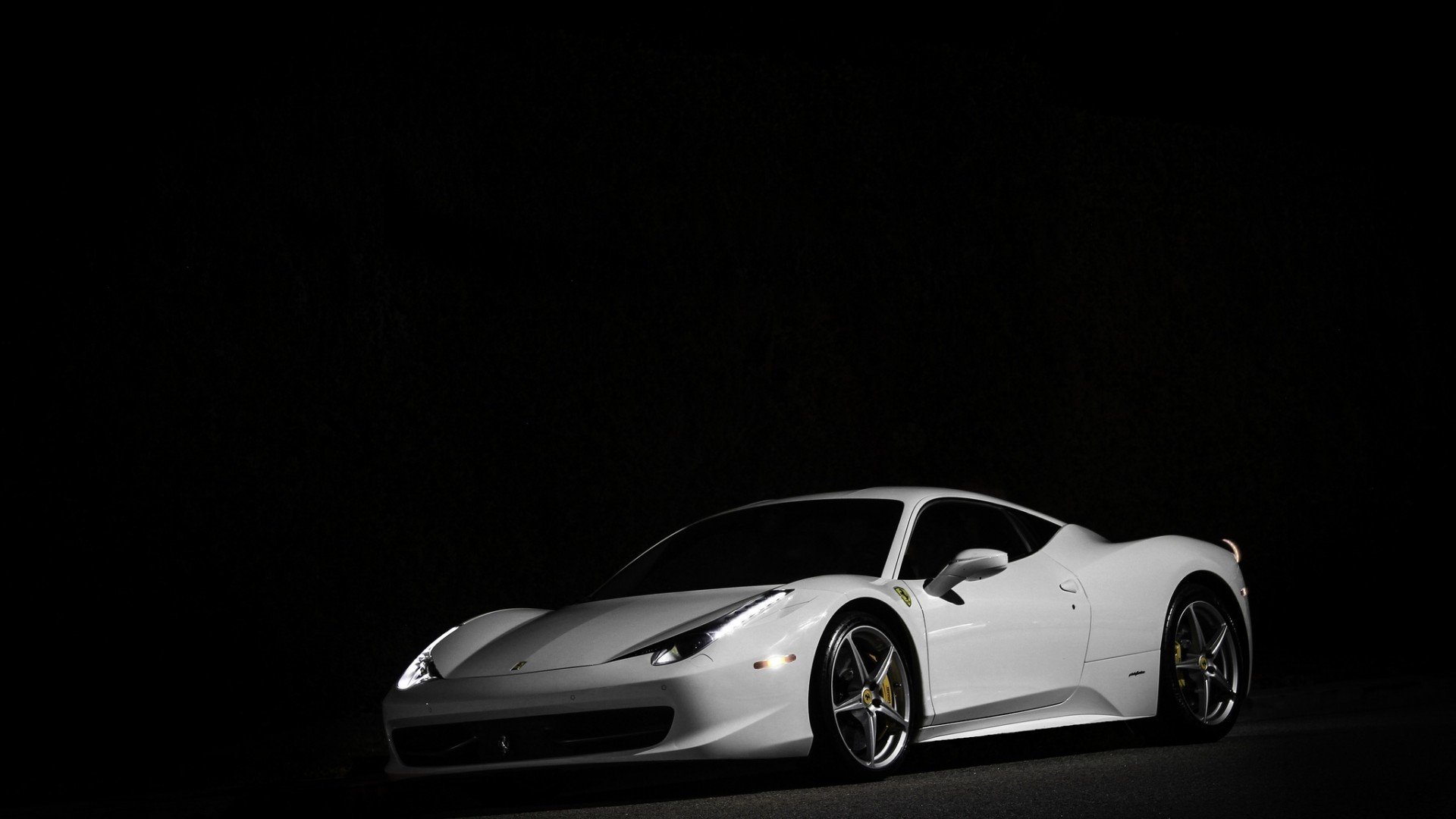 HD PC desktop wallpaper featuring a sleek white Ferrari sports car against a black background, highlighting its aerodynamic design and luxury appeal.