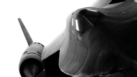 Close-up HD desktop wallpaper of a Lockheed SR-71 Blackbird military reconnaissance aircraft showcasing its sleek, aerodynamic design in black and white.