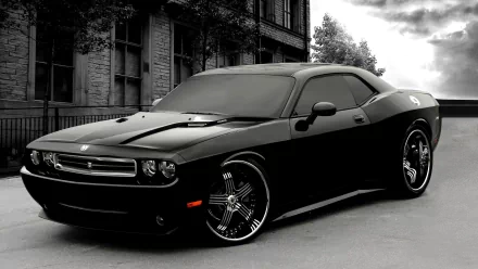 HD desktop wallpaper featuring a black Dodge Challenger parked on a street with stormy skies overhead.