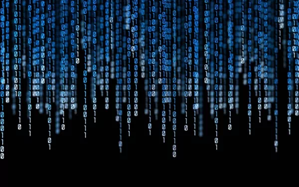 HD wallpaper featuring a digital rain of binary code, representing programming, on a black background.