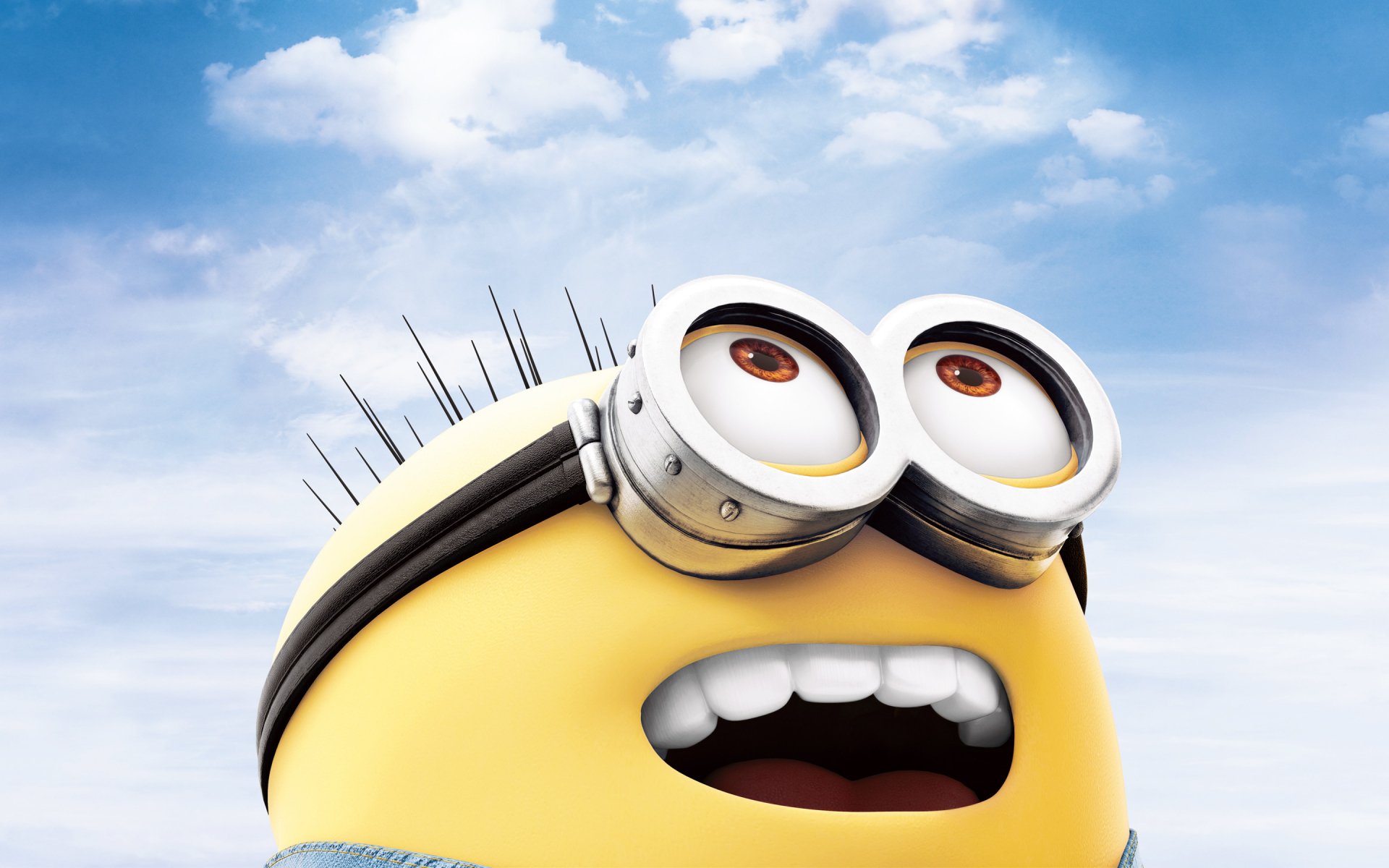 A cheerful Minion from *Despicable Me 2* beams against a bright blue sky, offering a fun and vibrant HD desktop wallpaper.