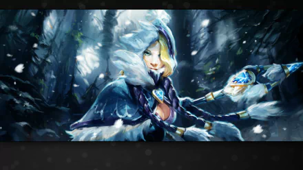 HD desktop wallpaper featuring a DotA 2 character in a snowy forest, dressed in a blue hooded cloak and holding a glowing magical staff.
