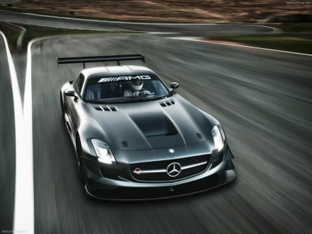 HD PC desktop wallpaper featuring a sleek black Mercedes-Benz AMG racing car speeding on a track.