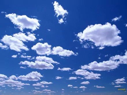 HD PC desktop wallpaper showing a vibrant blue sky dotted with fluffy white clouds, capturing the beauty of nature.