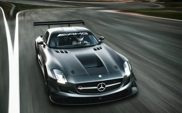 HD PC desktop wallpaper featuring a sleek black Mercedes-Benz AMG racing car speeding on a track.