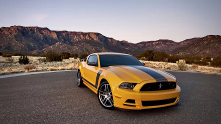 A striking Ford Mustang Shelby in vibrant yellow and black parked against a scenic mountain backdrop, featured as an HD PC desktop wallpaper and background.