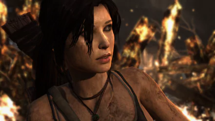 HD PC desktop wallpaper featuring Lara Croft from the 2013 Tomb Raider video game, depicted with a determined expression against a fiery background.