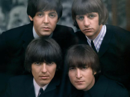 HD wallpaper featuring close-up portrait of The Beatles members, including John Lennon and Paul McCartney, exemplifying iconic music era.