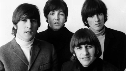 HD wallpaper featuring a classic black and white portrait of The Beatles, showing John Lennon and Paul McCartney with their bandmates.