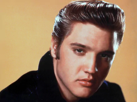 A striking HD wallpaper featuring Elvis Presley, capturing the essence of music and charisma with a close-up portrait against a warm backdrop.