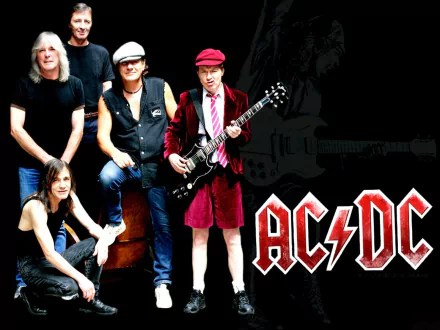 A vibrant HD desktop wallpaper featuring AC/DC members, including Angus Young, showcasing their iconic style and energy in a classic band ensemble.