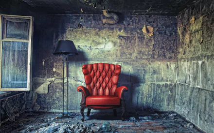 A striking HD wallpaper featuring a vintage red armchair beside a stylish lamp in a worn, atmospheric room. The furniture contrasts with the textured, weathered walls, creating a moody scene.