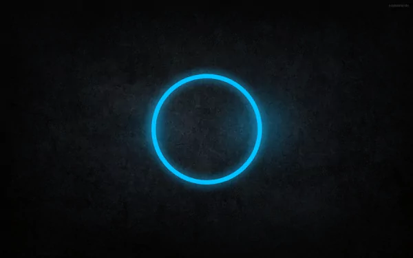 Abstract blue circle on a dark background, creating a modern and sleek design. This HD image serves as a captivating desktop wallpaper and background.