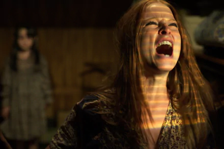 Rachel Nichols in a tense scene from The Amityville Horror (2005), captured as an HD PC desktop wallpaper and background.
