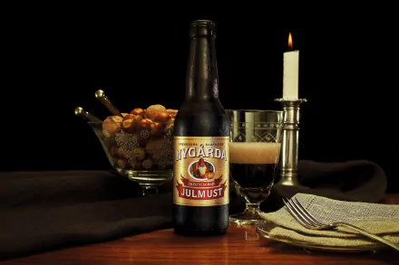 A bottle of Nygaarda Julmust sits on a wooden table, surrounded by a bowl of snacks and a candle, creating a cozy atmosphere for food and beer lovers. 4K Ultra HD background.