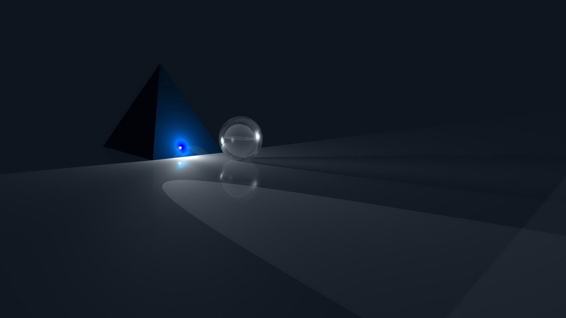 Abstract HD PC desktop wallpaper featuring a glowing blue pyramid and a reflective glass sphere casting soft light and shadows on a dark surface.