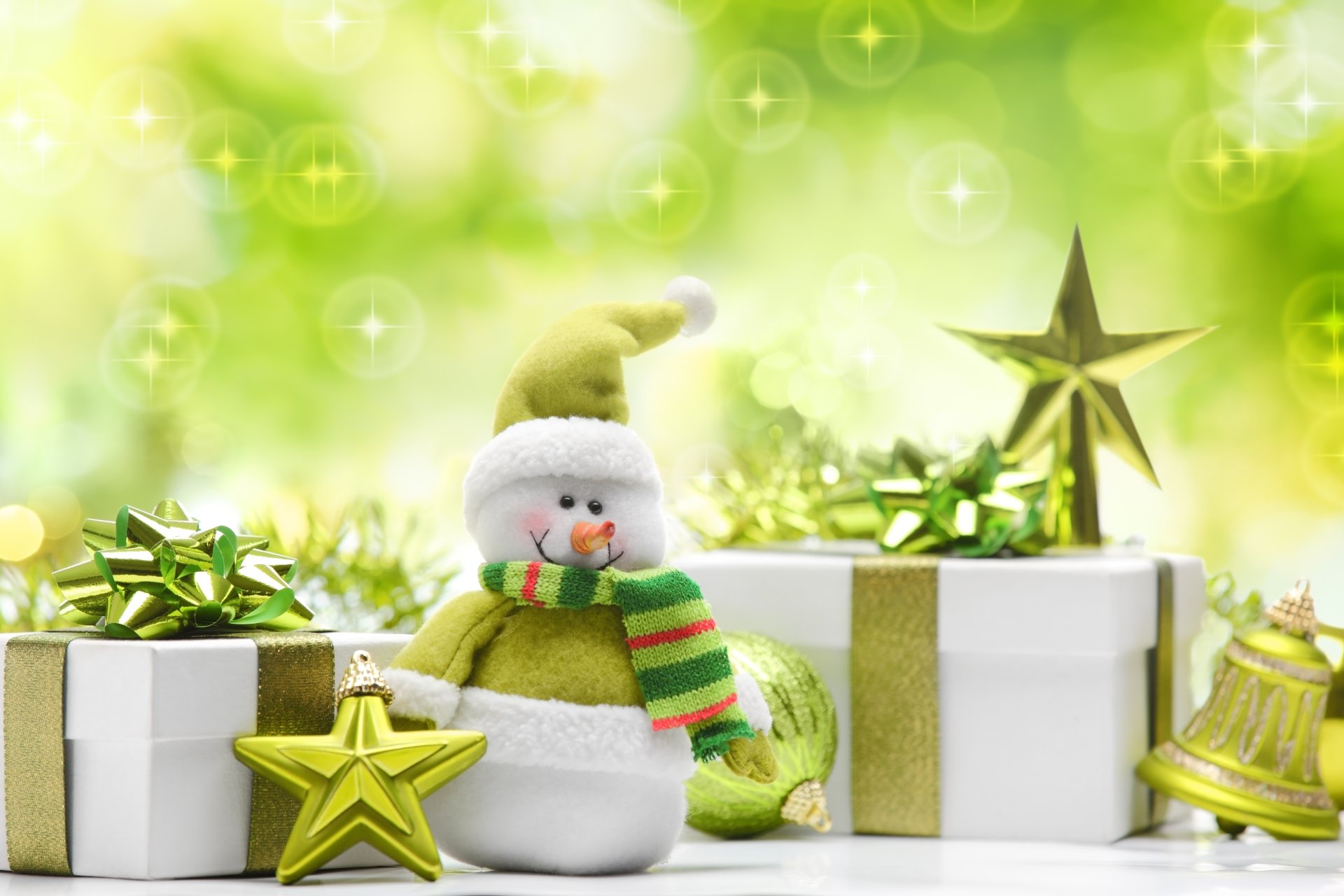 A festive scene featuring a cheerful snowman in a green scarf, surrounded by wrapped gifts and holiday ornaments, set against a vibrant, sparkling green background.