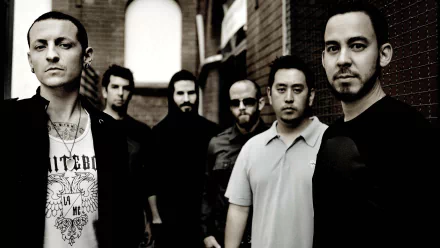 A striking HD desktop wallpaper featuring the band Linkin Park, showcasing the six members in a monochromatic setting against a textured background.