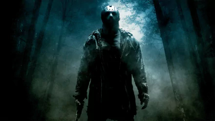 HD wallpaper of Jason Voorhees from the 2009 movie Friday the 13th, featuring the iconic masked figure standing menacingly in a foggy forest backdrop.