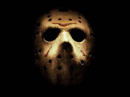 HD desktop wallpaper featuring Jason Voorhees from the 2009 movie Friday the 13th, showcasing his iconic hockey mask against a dark background.