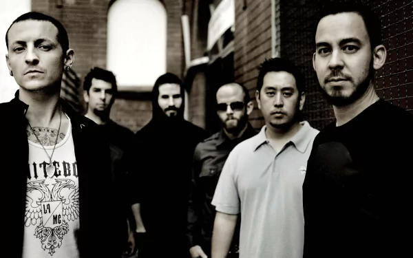 A striking HD desktop wallpaper featuring the band Linkin Park, showcasing the six members in a monochromatic setting against a textured background.