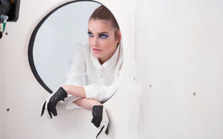 HD desktop wallpaper featuring Hungarian brunette model and celebrity Barbara Palvin posing with intense gaze and black gloves against a minimalist white background.