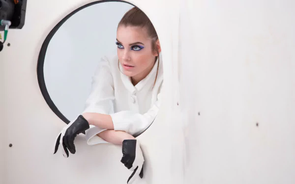 HD desktop wallpaper featuring Hungarian brunette model and celebrity Barbara Palvin posing with intense gaze and black gloves against a minimalist white background.