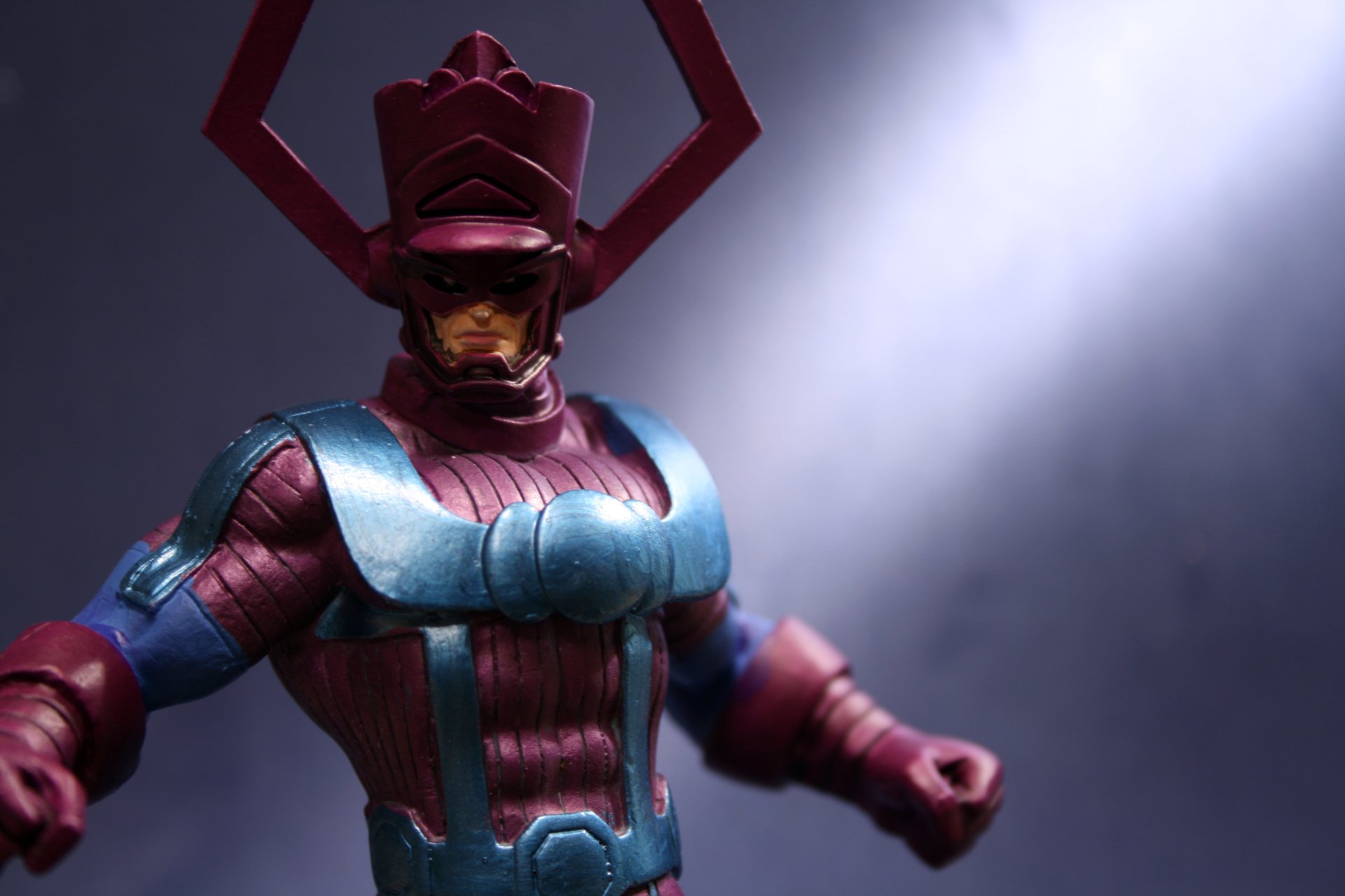 Comic Galactus in purple-blue armor under a dramatic spotlight with smoky backdrop — 4K Ultra HD PC desktop wallpaper and background.