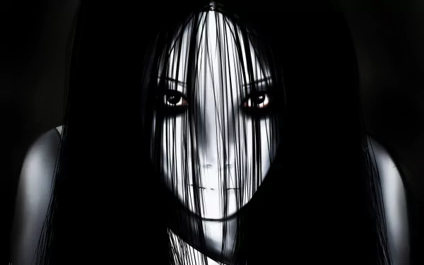 HD desktop wallpaper featuring a haunting close-up of Kayako from the 2004 horror movie The Grudge, with dark hair obscuring her pale, eerie face.