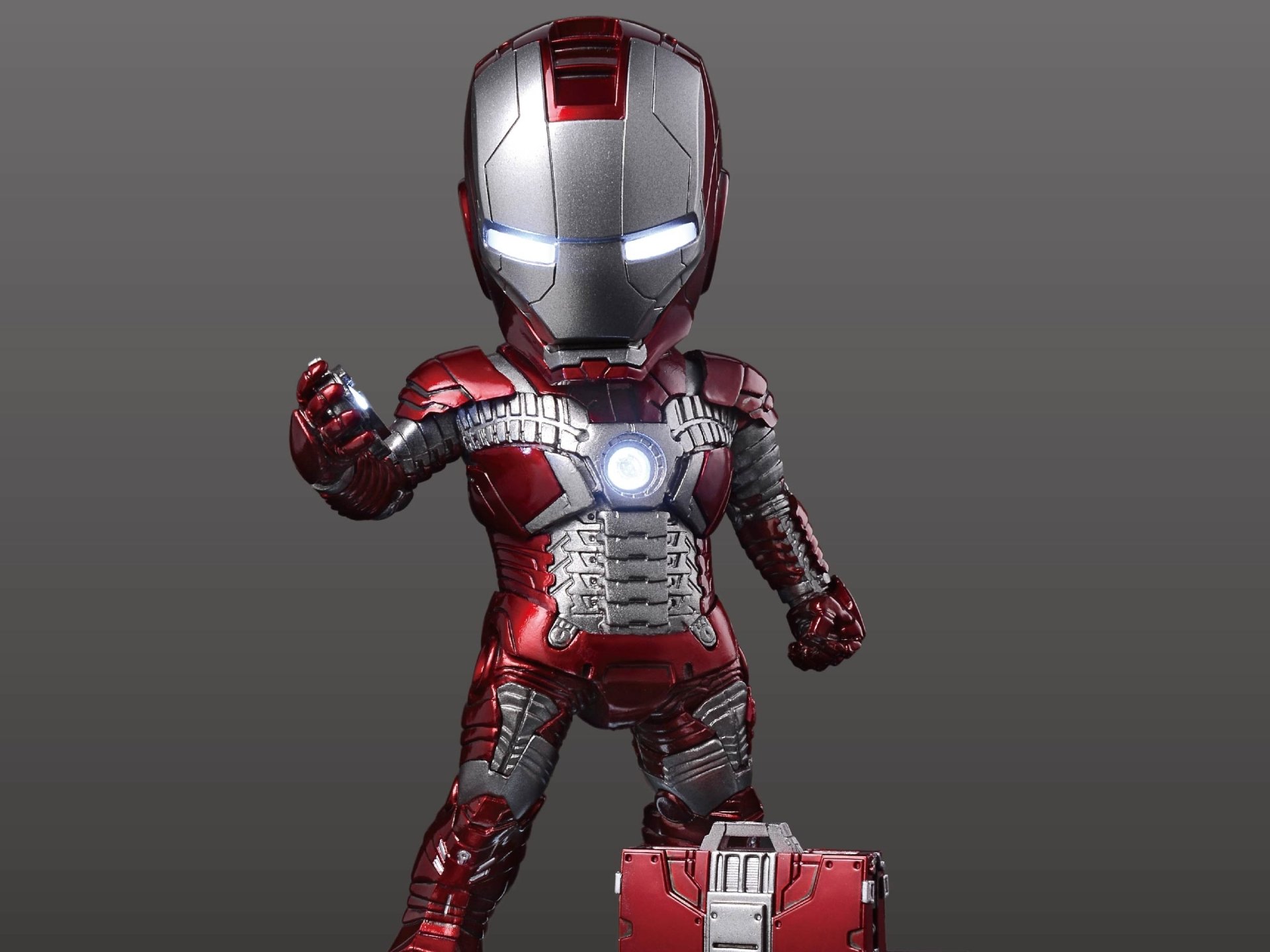 HD PC desktop wallpaper featuring a stylized Iron Man 2 character in detailed red and silver armor with glowing eyes and arc reactor.