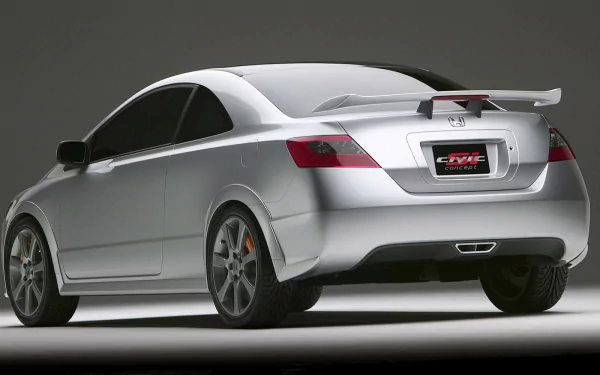 A sleek, silver Honda Civic from the rear, showcasing its sporty design and bold rear spoiler. This HD image serves as an impressive desktop wallpaper and background.
